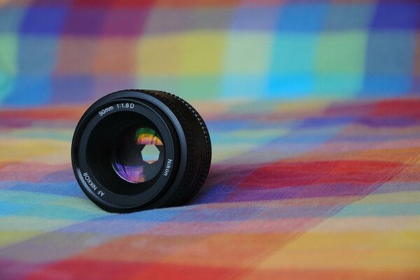 Objectif Nikon sur fond de tissu à Carreaux
