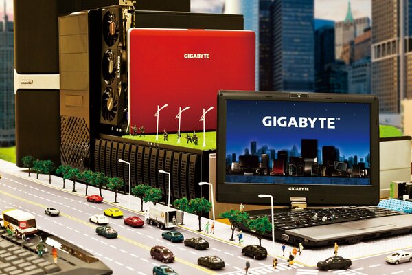 Publicité ordinateur portable gigabyte en miniature avec des machines et des personnes