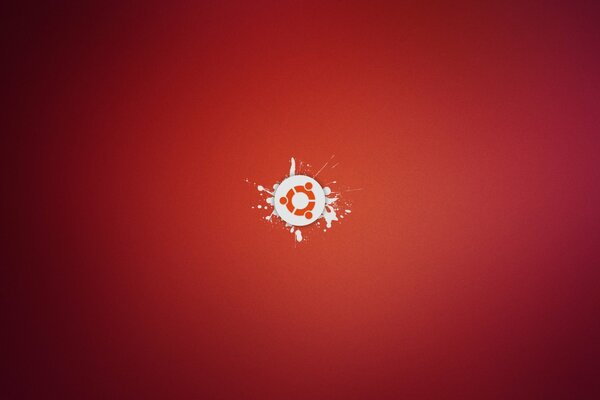 Logo Ubuntu minimaliste sur fond rouge avec des éclaboussures