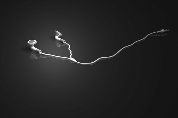 Écouteurs blancs se trouvent sur un fond gris miroir