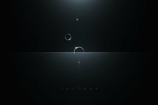 Cercles transparents lumineux tombant sur fond noir