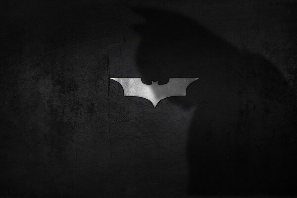 Logo de l ombre de Batman sur fond de chauve-souris