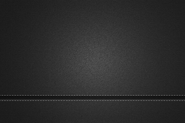 Couture noire sur un Jean gris