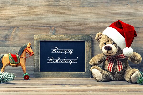 Joyeux nouvel an ours en peluche dans le chapeau